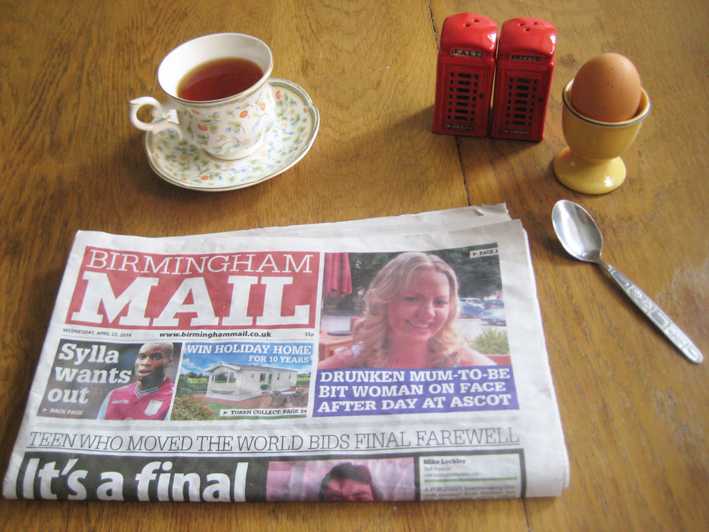 breakfast: a cup of tea, a boiled egg and the newspaper