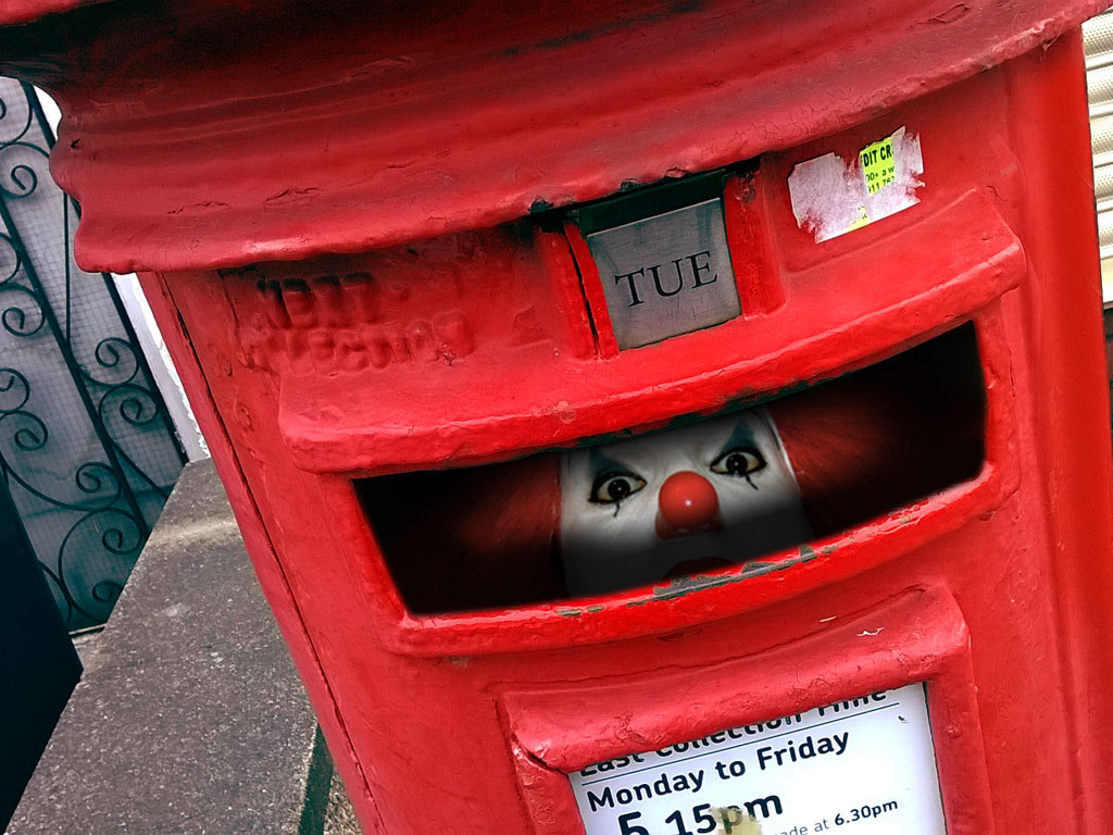 photo of scary Stephen King clown staring out from a postbox slot